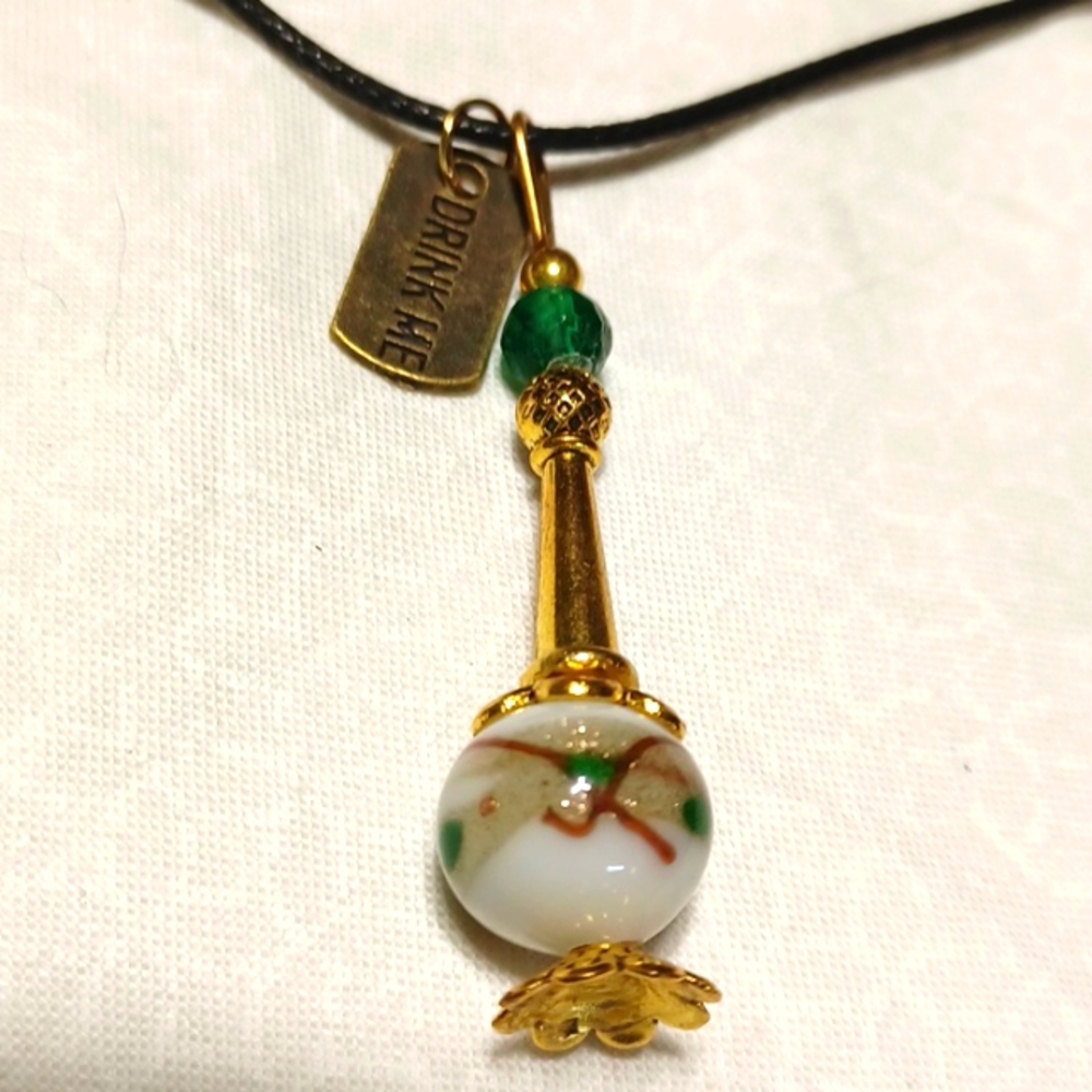 Alice in Wonderland potion bottle pendant necklace gold white green tag drink me
